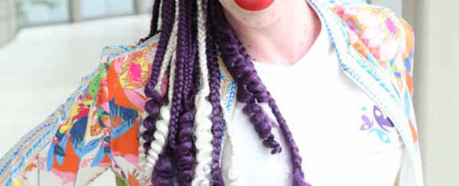 woman with Vitiligo wearing sunglasses and smiling