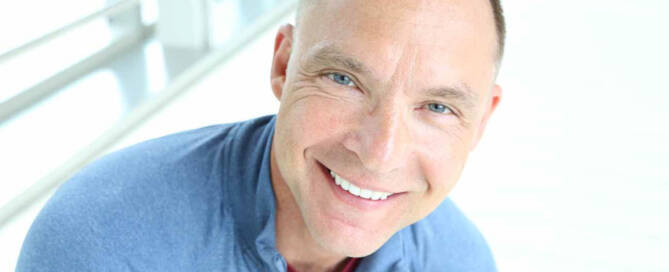 man with Vitiligo smiling looking into the camera