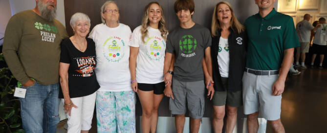 boy with Phelan-McDermid Syndrome standing with his extended family