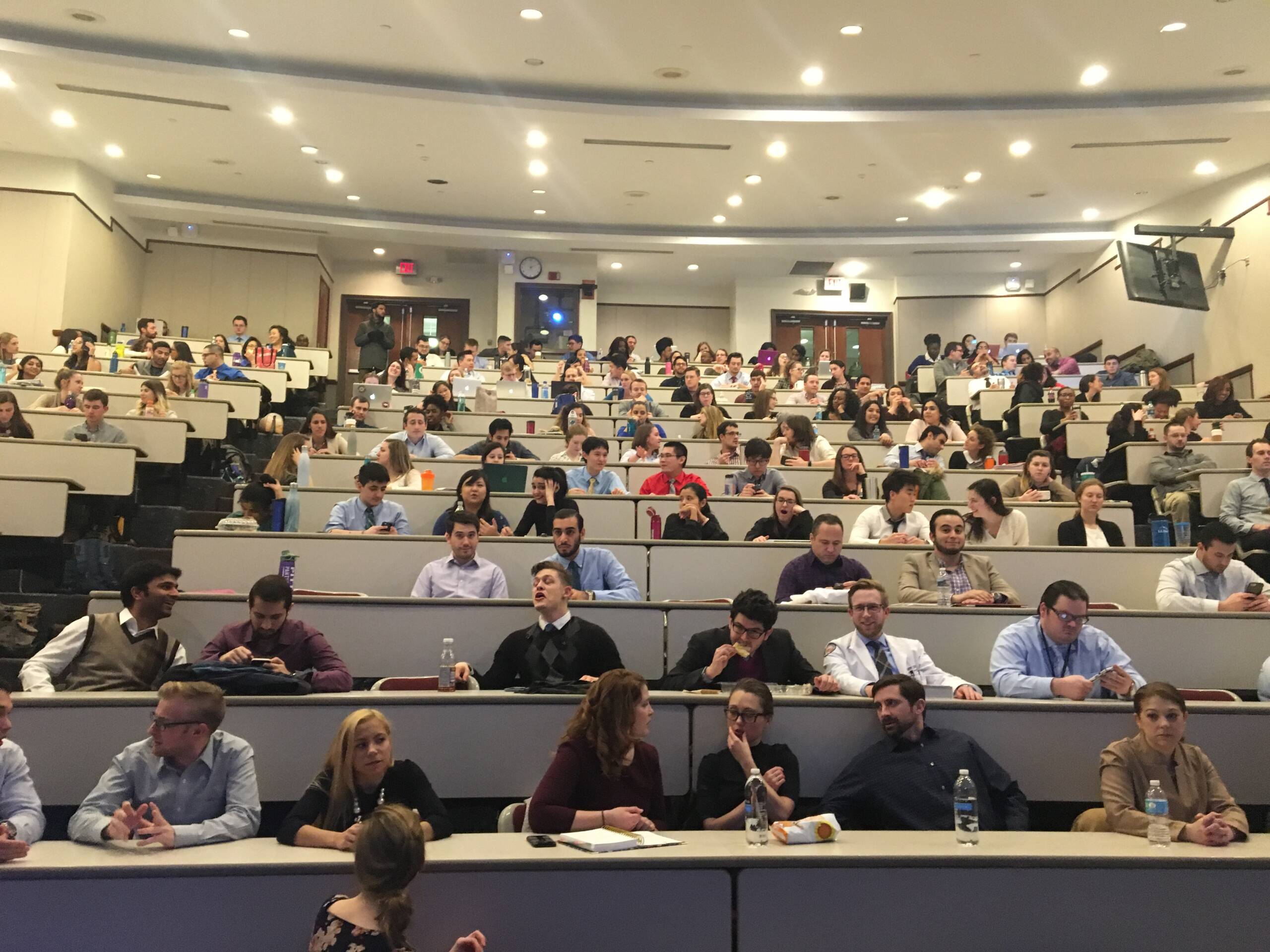 Students sitting in amphitheater like classroom